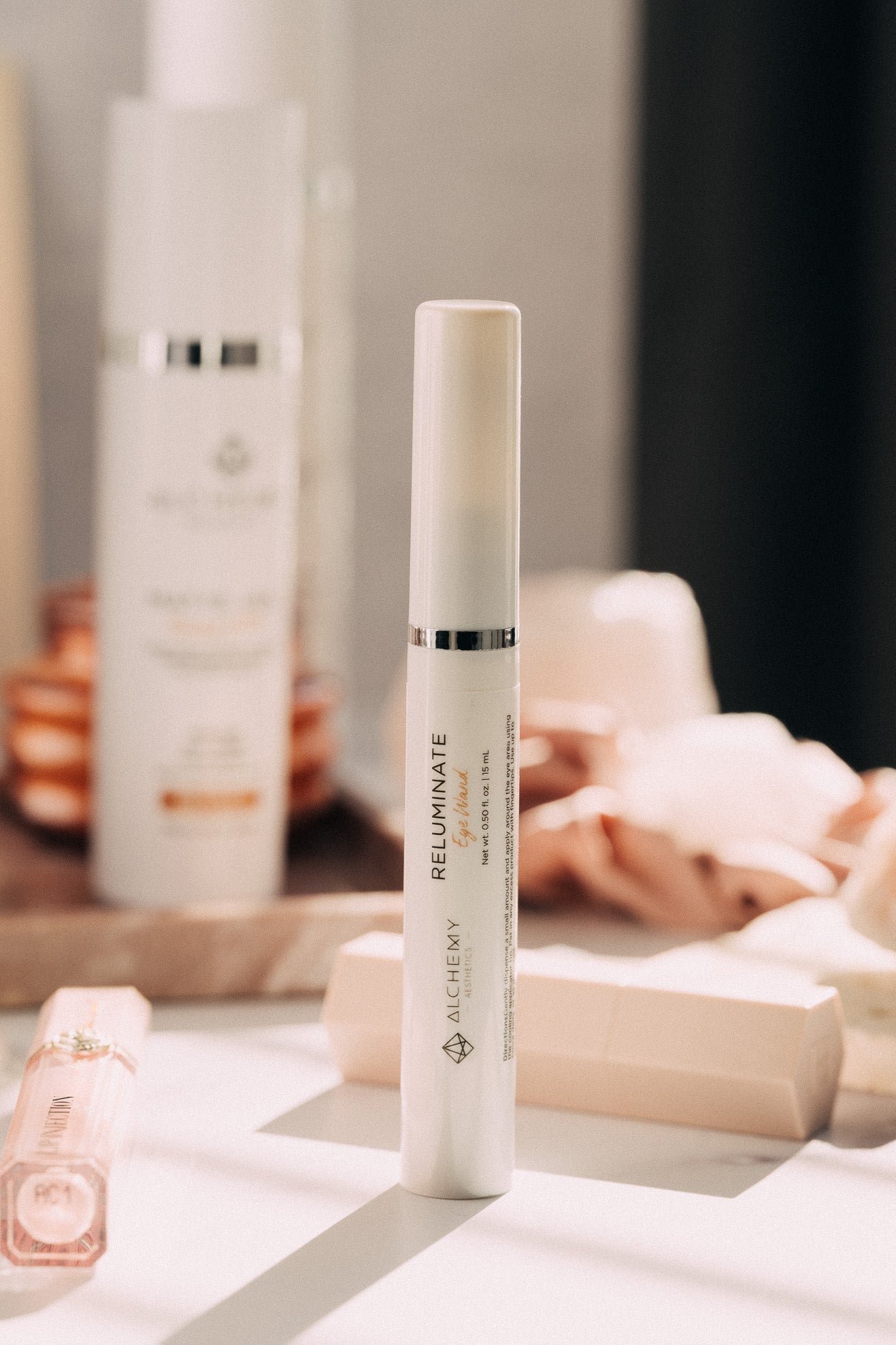 Skincare product with 'L'UNIQUE' branding on a blurred background